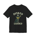 "Dinked & Loaded" pickleball t-shirt in Black, front view, hand holding a martini with a paddle